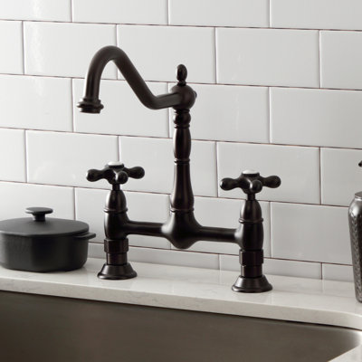 Kingston Brass Heritage Two-Handle 2-Hole Deck Mount Bridge Kitchen Faucet