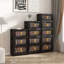 Armoire de rangement pliante polyvalente avec plusieurs niveaux, portes magnétiques, roulettes, idéale pour organiser divers espaces dans votre maison