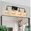 Éclairage pour salle de bain 4 lumières Mid-Century moderne avec élégants globes en verre transparent noir mat et or-129899852