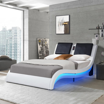 Faux Leather Queen Platform Bed With LED Lighting, Bluetooth Music, And Adjustable Backrest Massage Functionality.