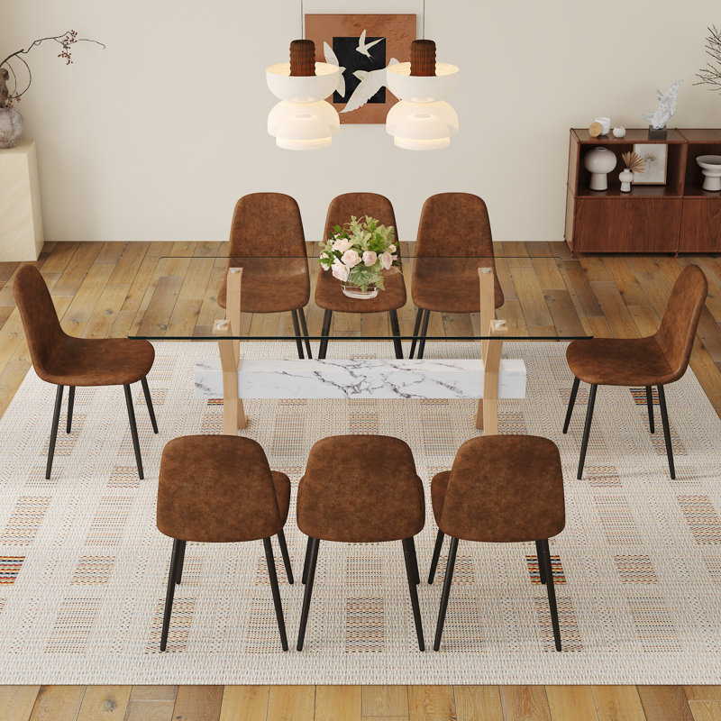 Élégante expérience culinaire: table en verre transparent avec chaises modernes en tissu technique pour les réunions à la maison