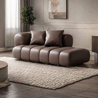 Chaise longue à large assise en similicuir