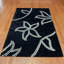 Tapis noir / blanc touffeté à la main-15344005