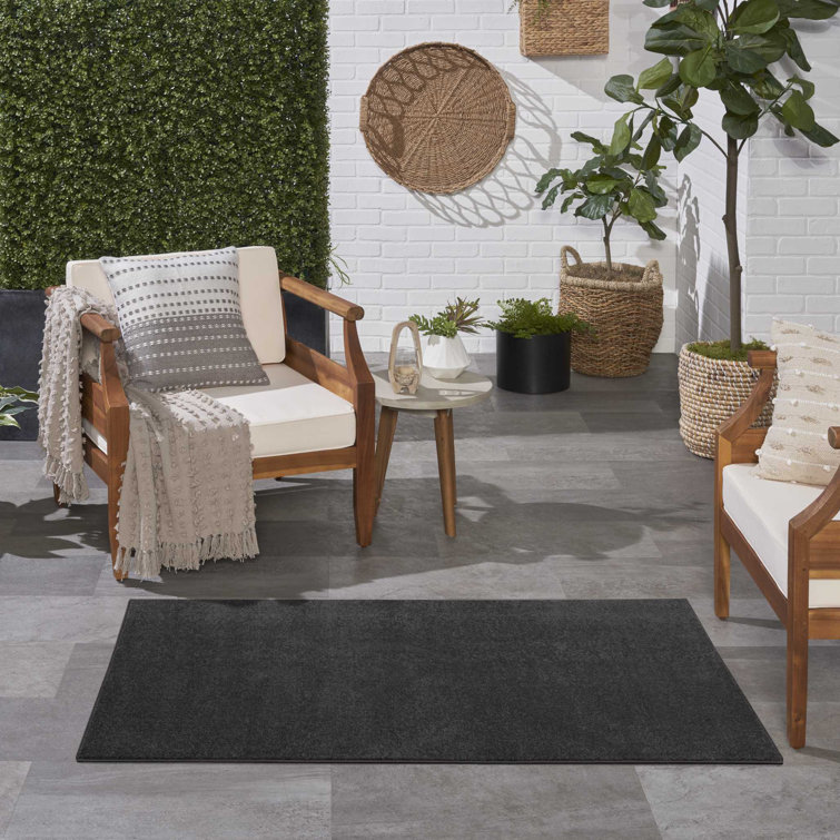 Mullican Sandy Solid Black Easy Care Indoor/Outdoor Area Rug