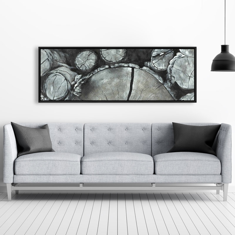 Bûches de bois empilées - décor de toile encadrée gris