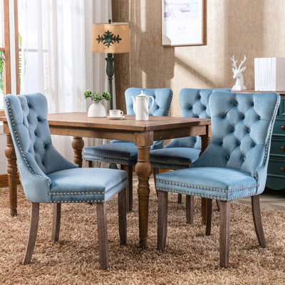 Confortable chaise de salle à manger rembourrée de mousse en velours bleu, Sw2001lb moderne avec housse en velours et boutons en métal,