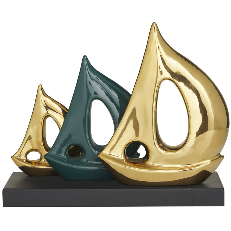 Sculpture voilier en polystone or avec base noire
