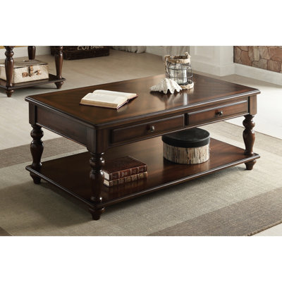 Table basse rectangulaire avec finition noyer et plateau relevable pour rangement