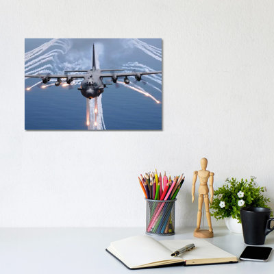 An AC-130H Gunship Aircraft Jettisons Flares As An Infrared Countermeasure by Stocktrek Images - Wrapped Canvas Print