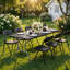 Black rectangular folding table with a powder-coated steel frame set for outdoor dining in a garden.