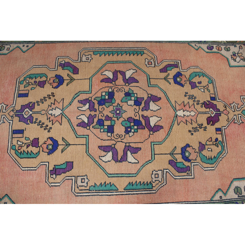 Tapis turc fabriqué à la main dans des tons pastel avec des motifs floraux complexes en laine
