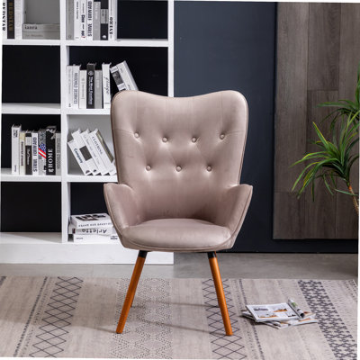 Fauteuil d'appoint contemporain à dossier capitonné en velours soyeux pour rehausser le décor et offrir des sièges confortables