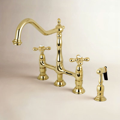 Kingston Brass Heritage Two-Handle 4-Hole Deck Mount Bridge Kitchen Faucet with Brass Side Sprayer