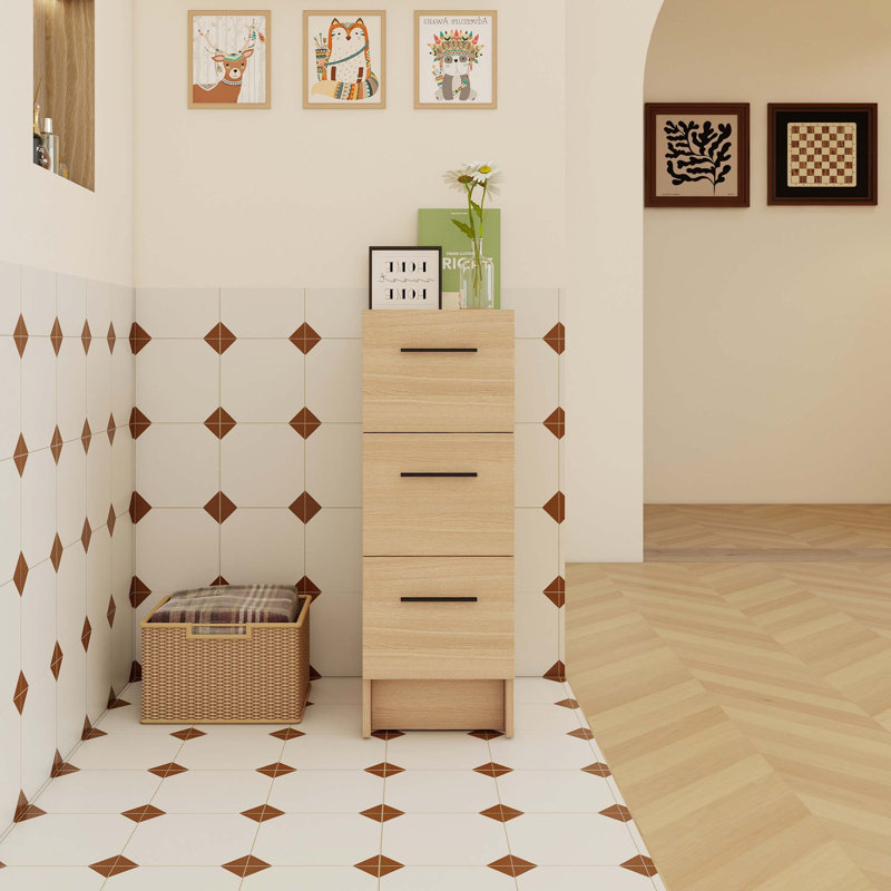 Armoire de rangement de salle de bain autoportante de 12 pouces avec trois tiroirs coulissants et un rangement vertical compact pour les salles de bain compactes.