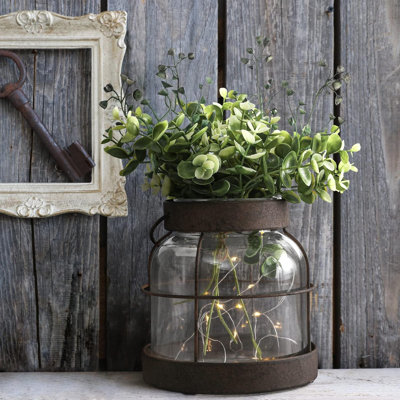Vase en verre vintage avec lanterne rustique, plante décorative et support de lumière