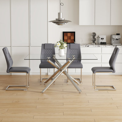 Table And Chair Set.Modern Luxurious Transparent Tempered Glass Dining Table Set With 4 Chairs.Single Fork Silver Metal Table Legs.Dark Gray High-Quality PU Dining Chairs With Silver Metal Legs.