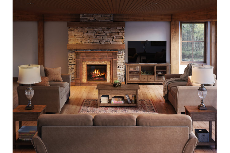 warm cabin living with stone fireplace