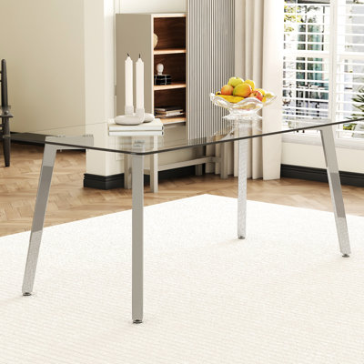 Table de salle à manger transparente en verre trempé de 71 x 35,4 pouces, avec des pieds en métal argentés en forme de 7, rehaussant votre table de bureau spacieuse et vos pieds fascinants