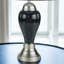 Élégante lampe de table artisanale avec base gris brillant, détails métalliques contrastants et abat-jour plissé pour un look moderne-1433959684-1433959686