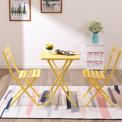 Ensemble de chaises bistro et de table carrée pliable jaune avec cadre en métal robuste pour l'extérieur jaune. Conception, cadre. , Rouille. Espaces de vie et bistro idéaux. Facile à plier