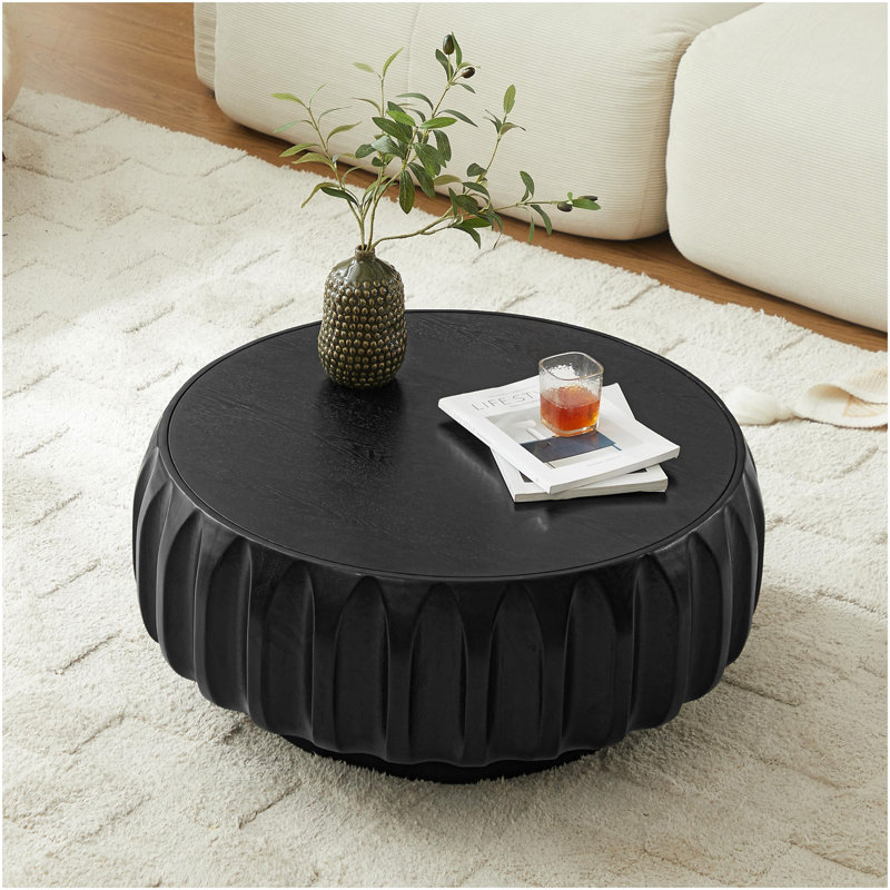 Table basse ronde en bois massif sculpté au design sculptural élégant, Noir
