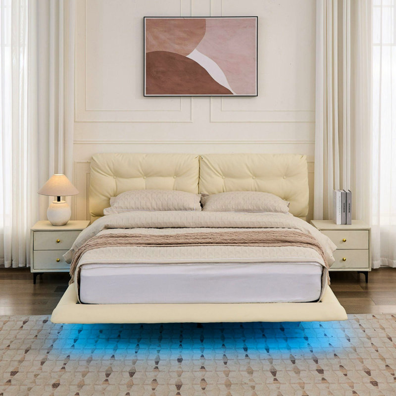 Cadre de lit grand blanc avec lumières à DEL, revêtu de cuir PU, lit flottant à boutons. Des pieds dissimulés, télécommandés pour un espace de chambre à coucher serein, des lumières en cuir stables et faciles à monter