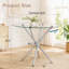 Table de salle à manger ronde en verre avec pieds en forme d'anneau-341073507