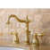 Kingston Brass Heritage Two-Handle 3-Hole Deck Mount Widespread Bathroom Faucet with Pop-Up Drain