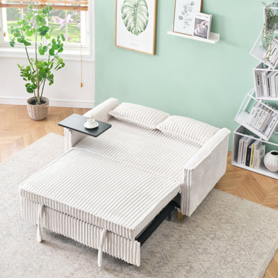 Le canapé escamotable en velours côtelé beige avec fonctions doubles