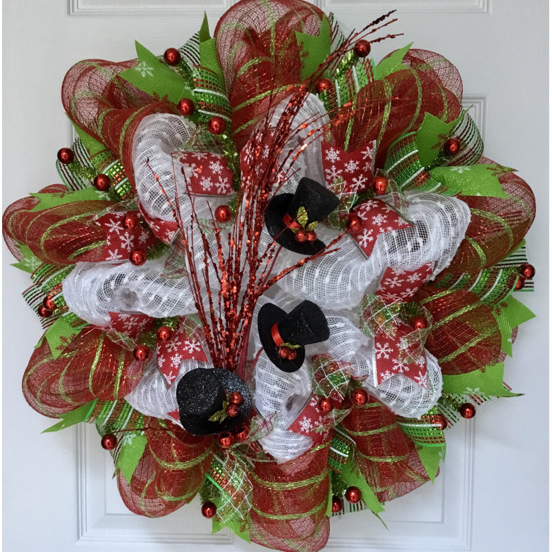 Couronne d'hiver avec jet de chapeaux de bonhomme de neige
