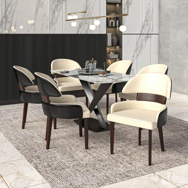 Chaise d'appoint de salle à manger en cuir avec dossier incurvé Consida, Noir/crème
