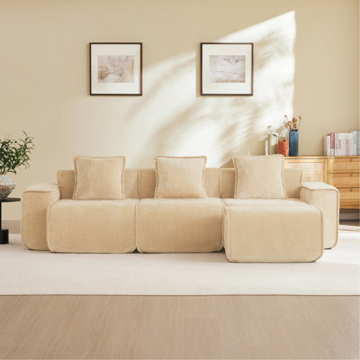Canapé d'angle modulaire 3 places en L, sans structure, avec passepoil français, livré monté, avec coussins décoratifs et 1 pouf amovible, en velours camel clair.