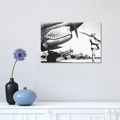 A Chinese Soldier Guards A Line Of American P-40 Fighter Planes During WWII by Stocktrek Images - Wrapped Canvas Print