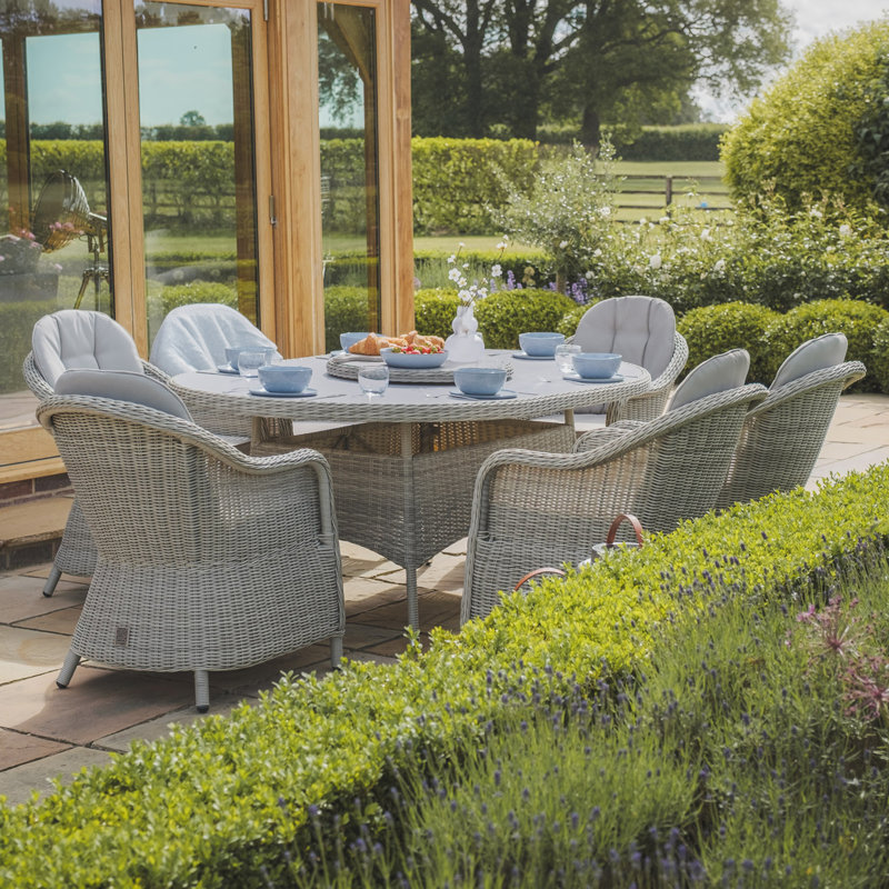 Anissah 6 - Person Patio Dining Set with Oval Table