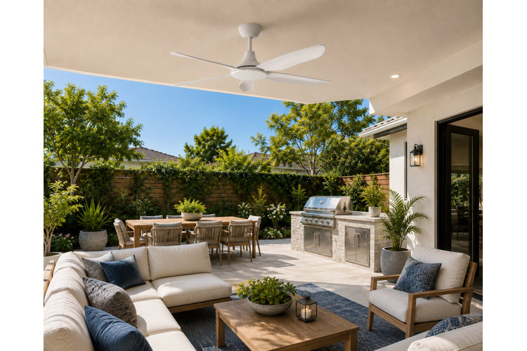 modern covered patio with an outdoor living room set, built-in grill, and outdoor dining table.