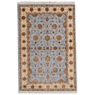 Tapis bleu et ivoire de haute qualité noué à la main