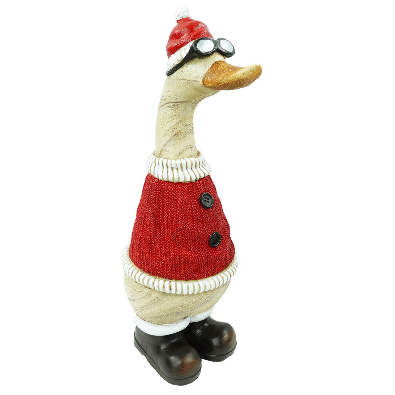 Noël canard de Noël en chandail rouge et chapeau statuaire