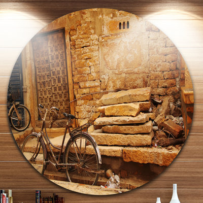 " Bicycle Against Brown Wall "