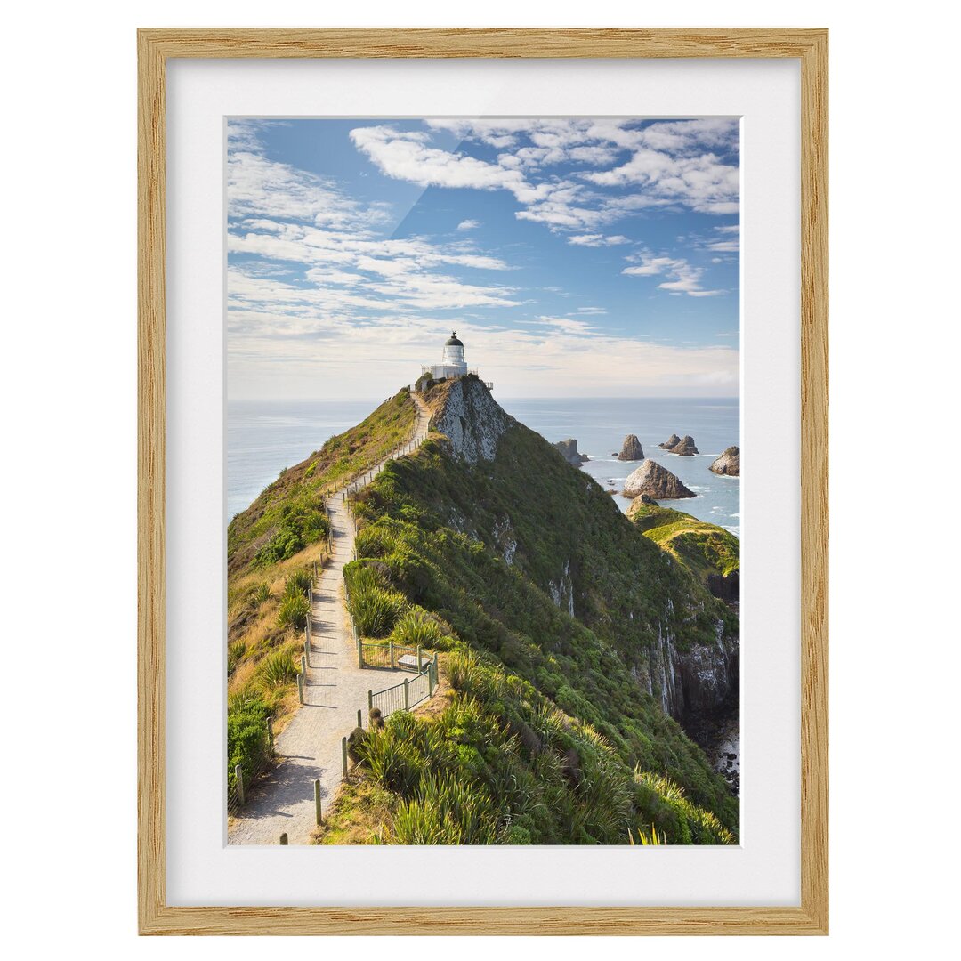 Gerahmtes Papierbild Nugget Point Leuchtturm und Meer Neuseeland