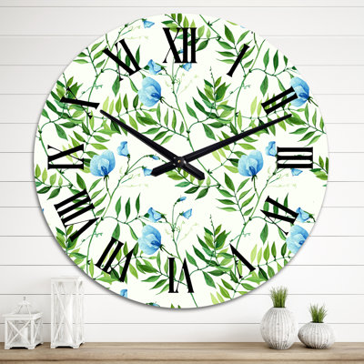 Horloge murale à motif de feuilles tropicales avec petites fleurs bleues