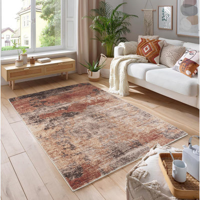 7 pi. 10 po X 10 pi 6 po Tapis