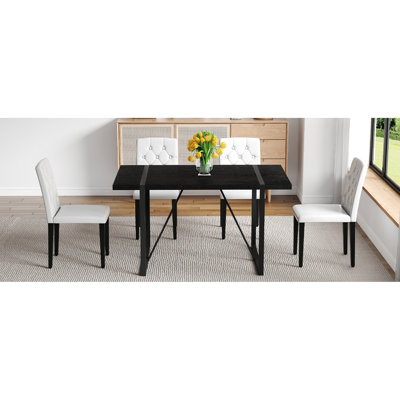 Table de salle à manger rectangulaire noire en faux grain de bois et 4 chaises en polyuréthane blanc, ergonomique, idéale pour les réunions de famille rétro minimaliste