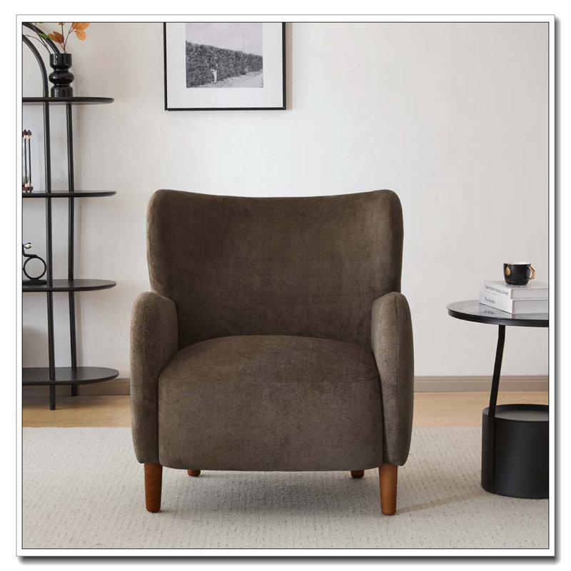 Fauteuil club à oreilles en velours