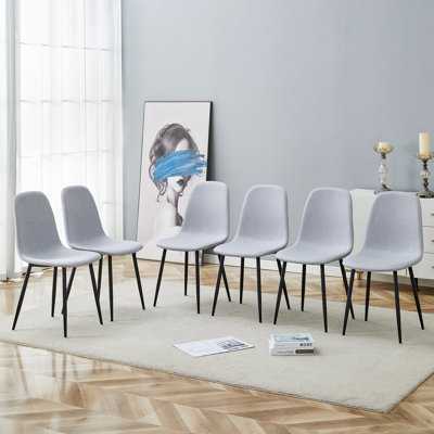 Confortable ensemble de chaises de salle à manger en lin et en coton - Six pièces en gris clair. Siège et dossier intégrés, matériau en lin et coton, assorti à la maison moderne.