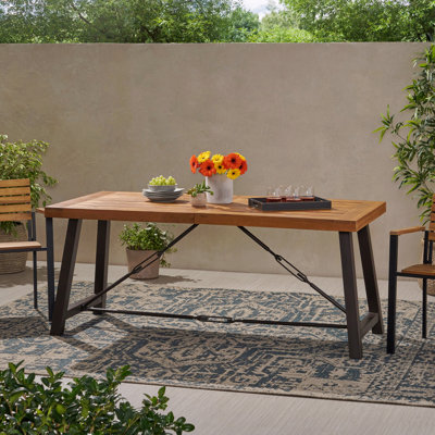 Table de salle à manger d'extérieur en bois d'acacia et en métal au design élégant pour toutes les maisons