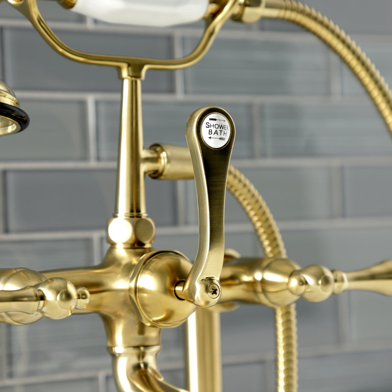 Kingston Brass Aqua Vintage Three-Handle 2-Hole Deck Mount Clawfoot Tub Faucet with Hand Shower, Brushed Brass
