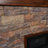Coletta Freestanding Electric Fireplace with Faux Stone Mantel-638192915
