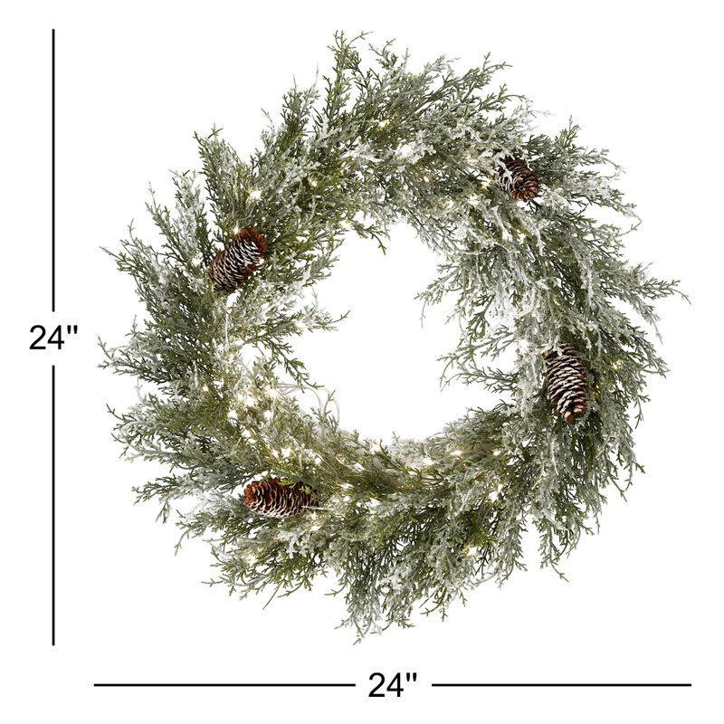 Couronne de Noël enneigée 24 po avec pommes de pin pré-éclairées The Holiday Aisle®