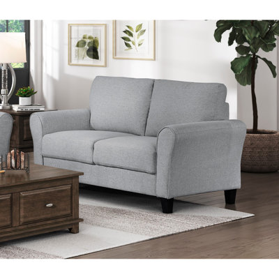 Causeuse moderne en tissu texturé gris foncé avec accoudoirs arrondis et coussins attachés