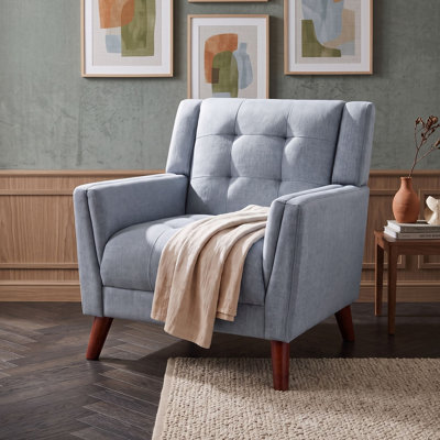 Fauteuil capitonné avec pieds en bois